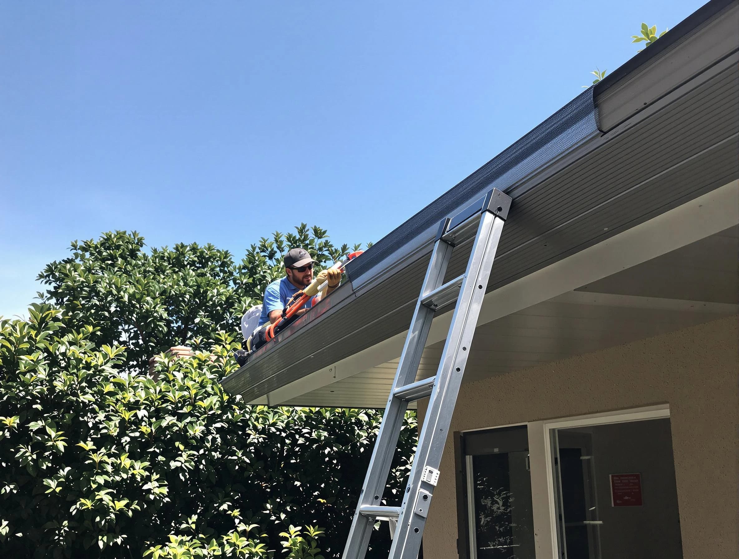 North Olmsted Roofing Company installing gutter guards for a homeowner in North Olmsted, OH